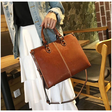 Black Elegant Leather Handbag - Stylish Brown Tote with Adjustable Strap, Spacious and Durable