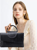 Black Elegant crocodile embossed clutch - with metal top handle and shoulder strap