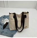 Stylish khaki canvas tote bag with detachable shoulder strap