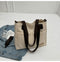 Stylish khaki canvas tote bag with detachable shoulder strap