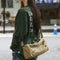 An elegant khaki shoulder bag for travel and work