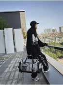 Grey Unisex Travel Bag with Utility Buckles and Wet/Dry Compartments